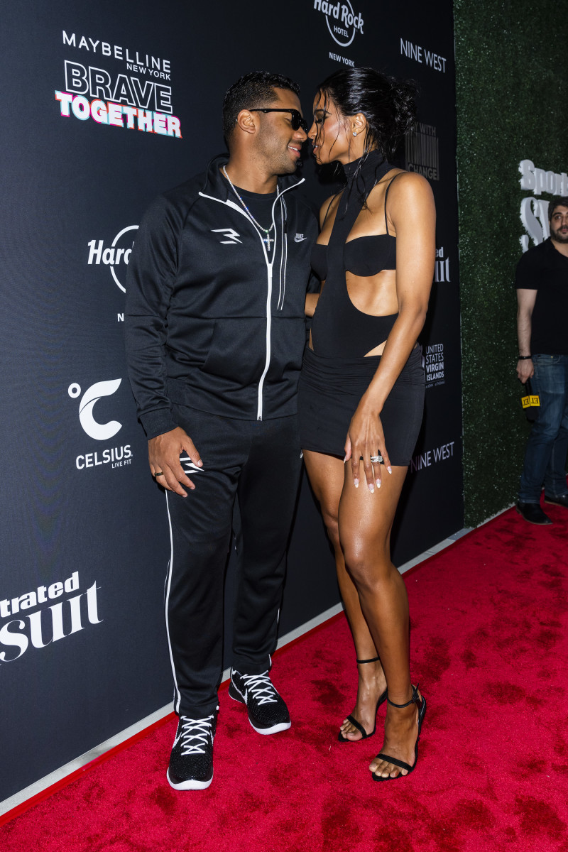 Cover model Ciara and husband Russell Wilson share a sweet moment on the red carpet.